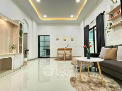 Spacious modern living room with elegant decor and dining area, featuring sleek furniture and ambient lighting.