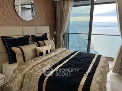 Luxurious bedroom with stunning ocean view and elegant decor
