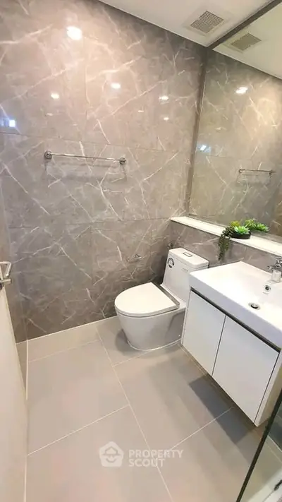Modern bathroom with sleek design and elegant fixtures in a contemporary home.