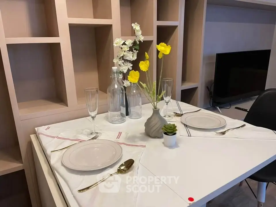 Stylish dining area with elegant table setting and modern decor, perfect for intimate gatherings.