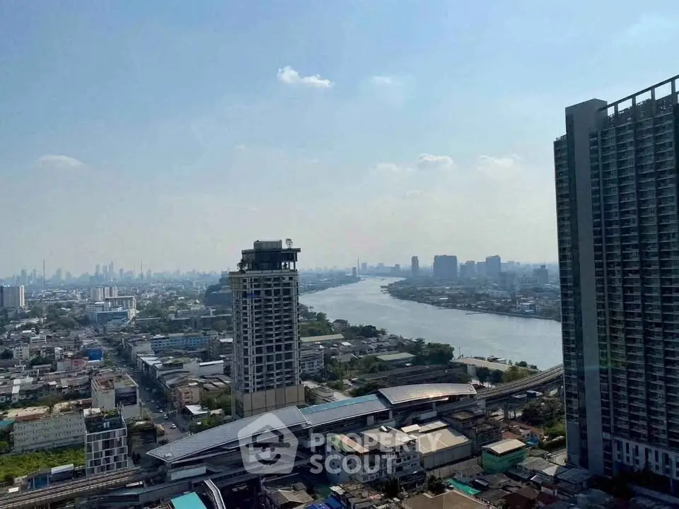 Stunning cityscape view with river and high-rise buildings, perfect for urban living enthusiasts.