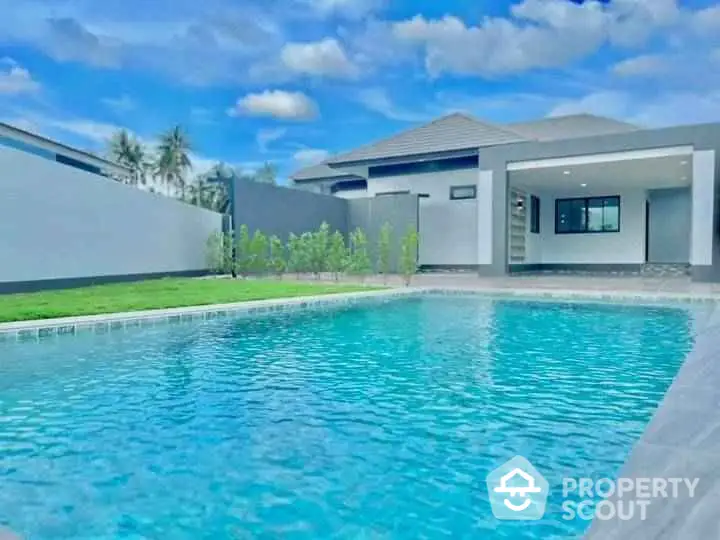 Luxurious modern home with private swimming pool and spacious outdoor area.