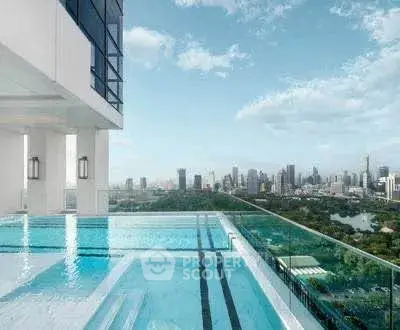 Luxurious rooftop pool with stunning city skyline view in modern high-rise building.