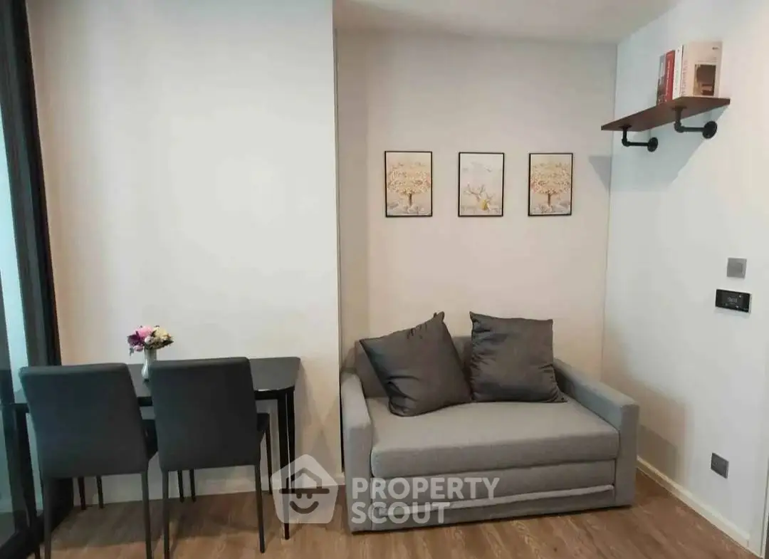 Cozy living room with modern decor and compact dining area, perfect for urban living.