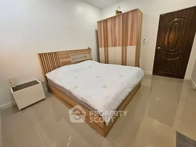 Modern bedroom with sleek wooden furniture and minimalist design