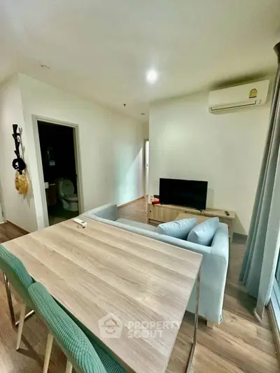 Modern living room with sleek furniture and air conditioning