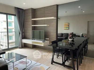 Modern living room with sleek furniture and large windows in a stylish apartment