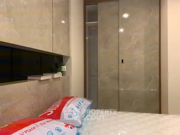 Modern bedroom with sleek built-in storage and stylish decor
