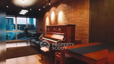 Chic living room with exposed brick wall and elegant piano