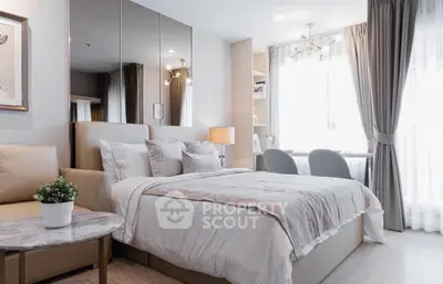 Luxurious bedroom with elegant decor and natural light, perfect for relaxation and comfort.