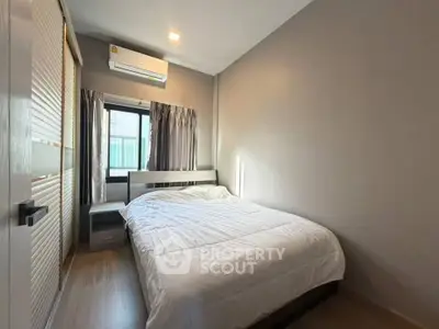 Cozy bedroom with modern design and ample natural light