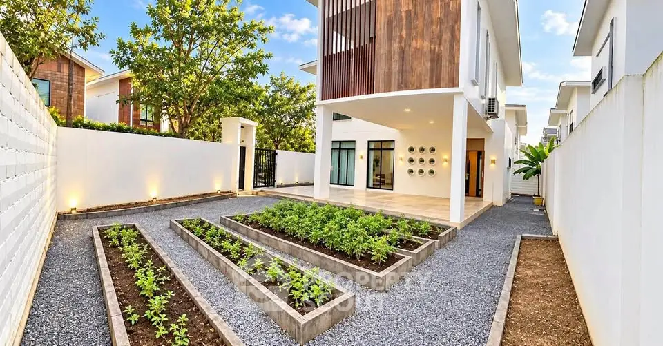 Modern two-story house with landscaped garden and spacious driveway