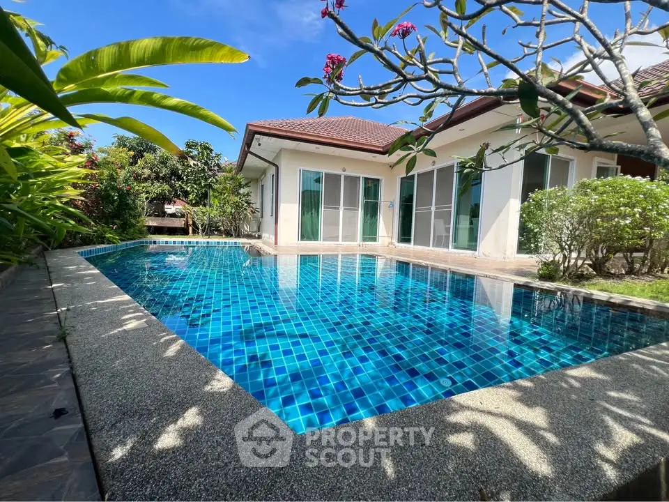 Stunning villa with private pool and lush garden, perfect for luxury living.