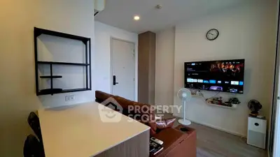 Modern living room with wall-mounted TV and stylish furniture