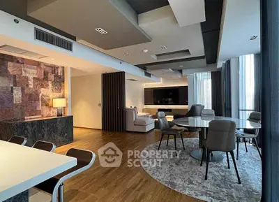 Luxurious modern living room with stylish furniture and elegant lighting, perfect for entertaining guests.