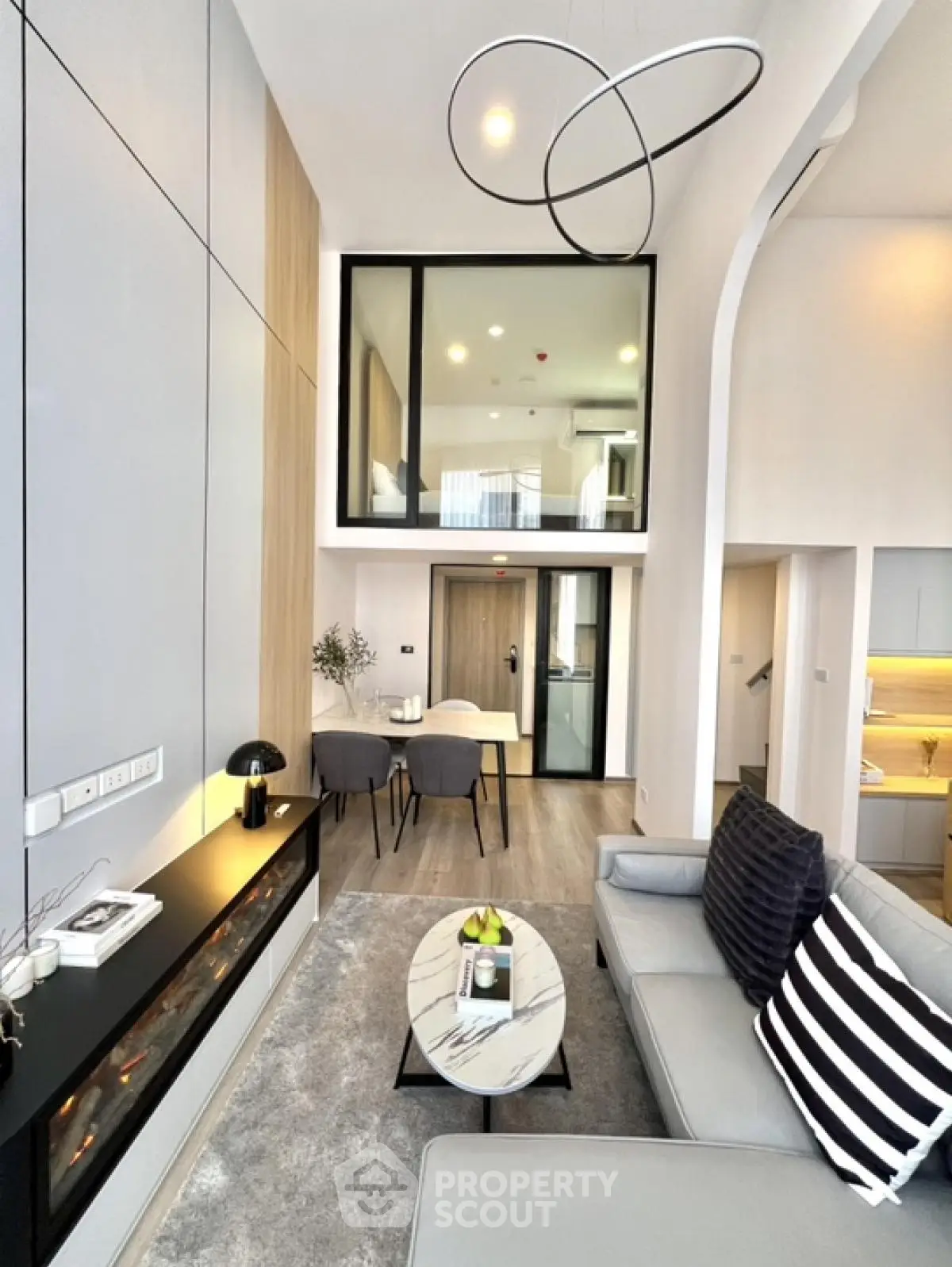Modern living room with high ceiling and stylish decor