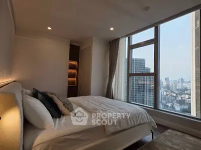 Luxurious bedroom with stunning city view and elegant decor