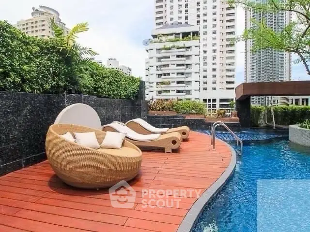 Luxurious rooftop pool with stylish loungers and city skyline view, perfect for relaxation and leisure.