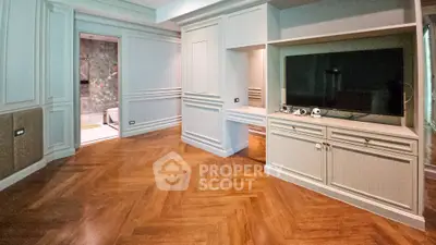 Elegant living room with parquet flooring and built-in TV unit