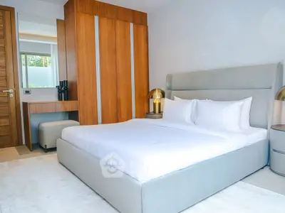 Luxurious modern bedroom with elegant wooden wardrobe and stylish decor