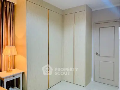 Modern bedroom with stylish wardrobe and elegant lighting