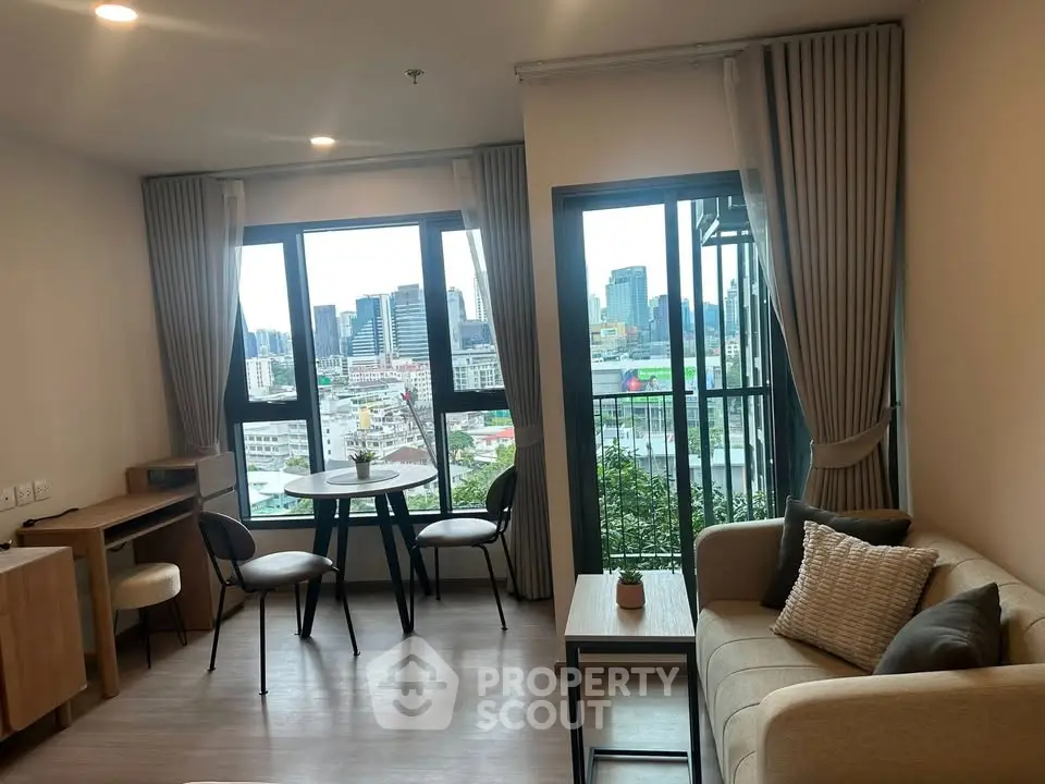 Modern living room with city view and stylish furniture