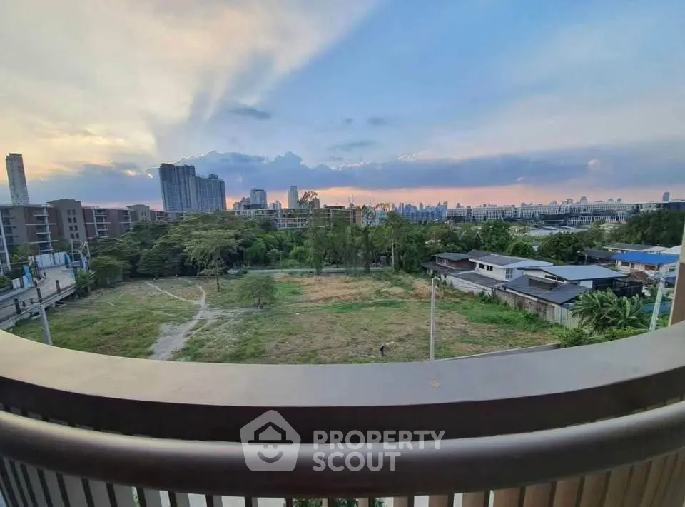 Stunning cityscape view from balcony at sunset, perfect for urban living.