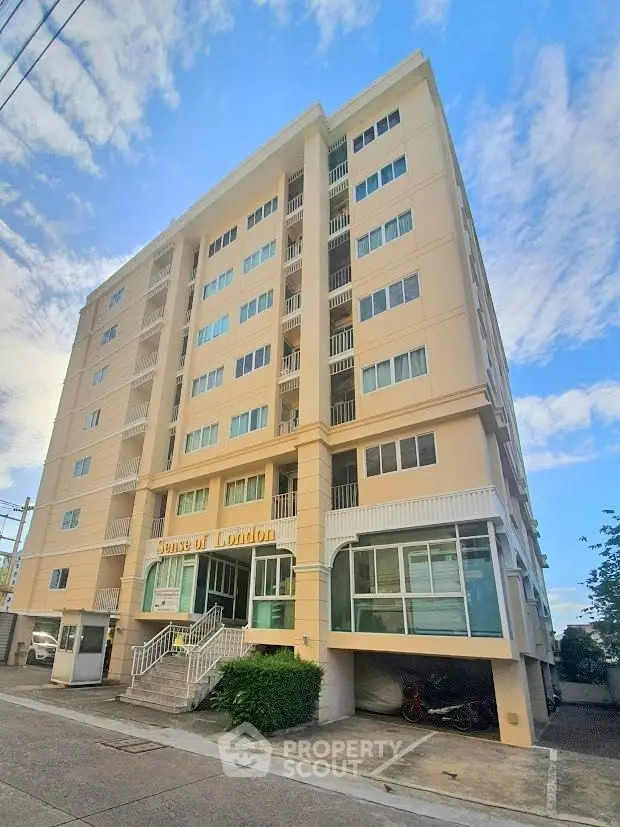 Modern apartment building with spacious balconies and contemporary design in urban setting.