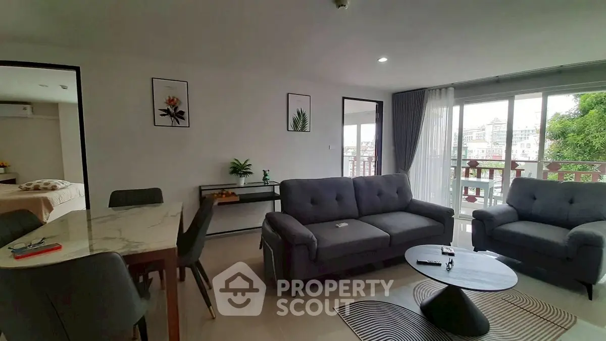Spacious living room with modern furniture and natural light