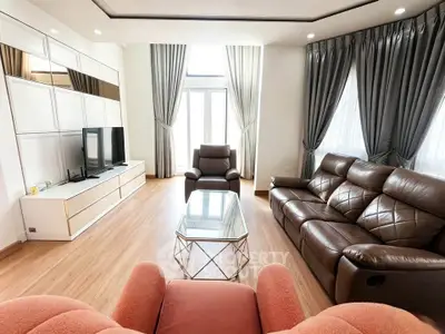 Spacious living room with modern furniture and large windows for natural light.