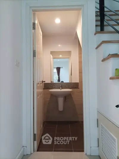Modern bathroom with sleek sink and mirror in a stylish home interior