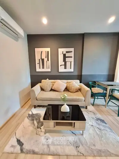 Modern living room with stylish decor and cozy seating area, perfect for relaxation and entertaining.