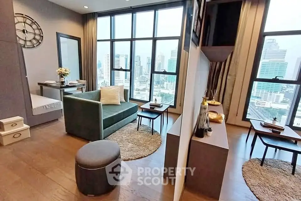 Modern living room with city view, featuring stylish decor and large windows in a high-rise apartment.