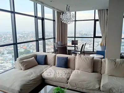 Luxurious living room with panoramic city views and elegant chandelier