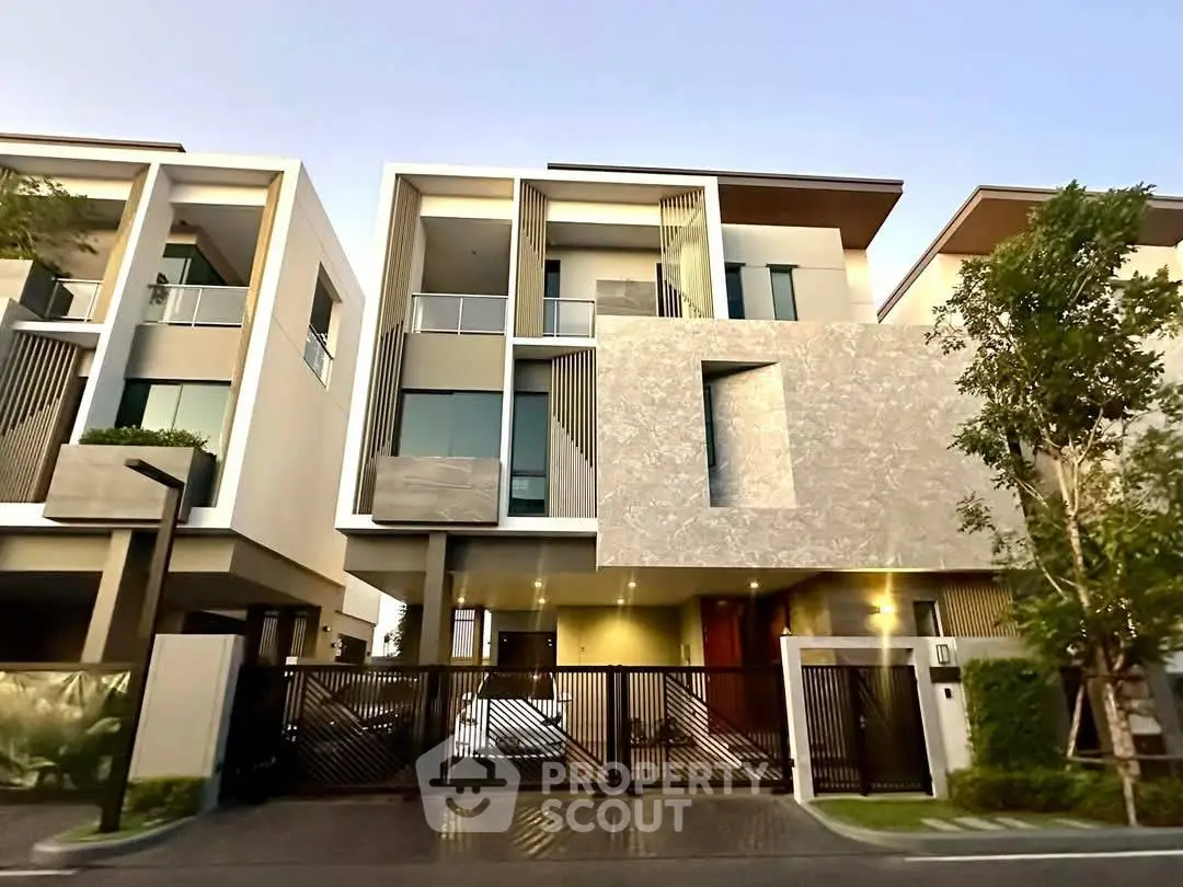 Modern luxury townhouse with sleek design and spacious balconies in a serene neighborhood.