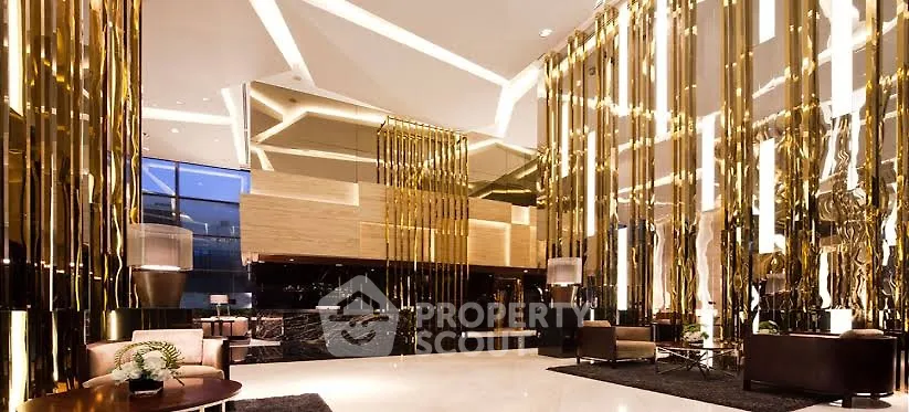 Luxurious modern lobby with golden accents and elegant lighting