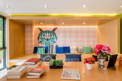Stylish modern living room with unique owl wall art and vibrant decor