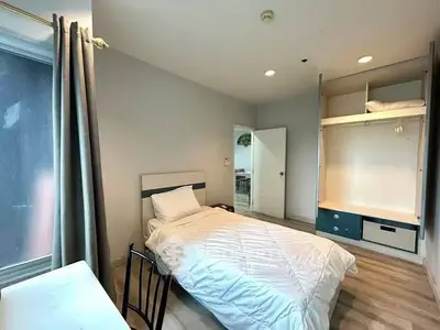 Cozy bedroom with modern design and ample natural light