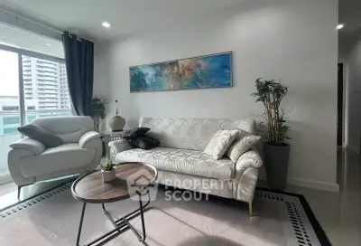 Modern living room with stylish furniture and large window view