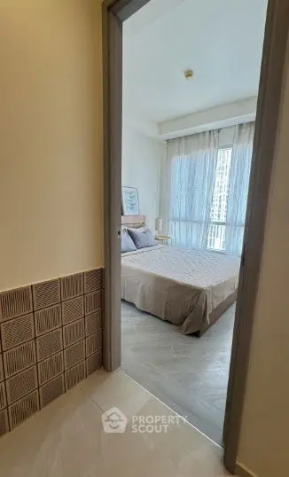 Cozy bedroom with large window and stylish decor