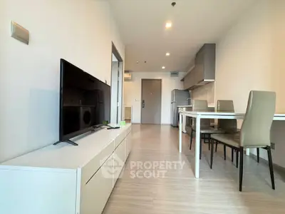 Modern open-plan living room with sleek furniture and dining area