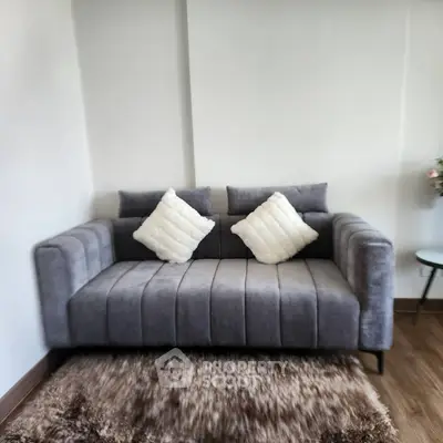 Cozy modern living room with plush gray sofa and stylish decor