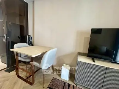 Modern living room with sleek furniture and TV, perfect for cozy gatherings.