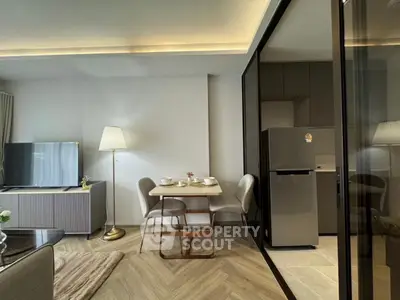 Modern living room with dining area and sleek kitchen design