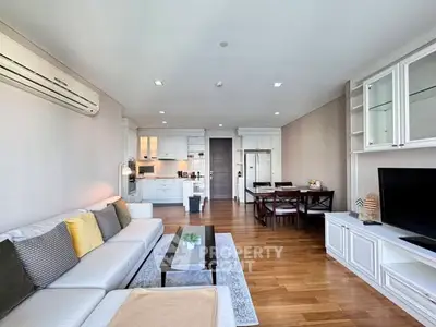 Spacious modern living room with open kitchen and elegant decor