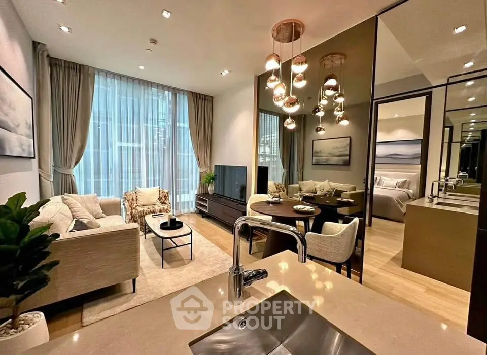 Luxurious open-plan living room with elegant decor and modern lighting