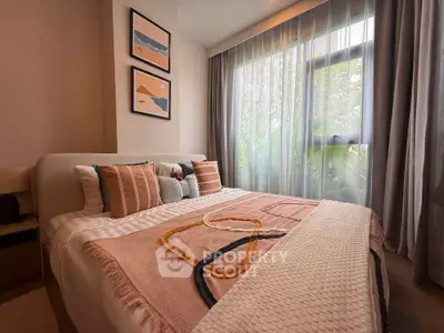 Cozy bedroom with large window and stylish decor in modern apartment