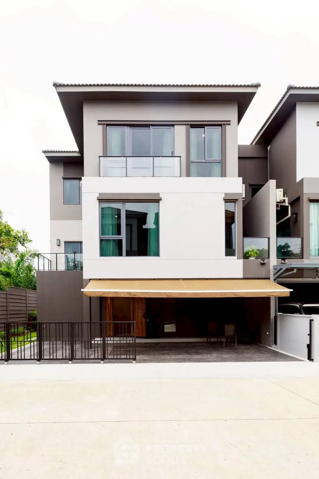 Modern multi-story townhouse with sleek design and spacious garage