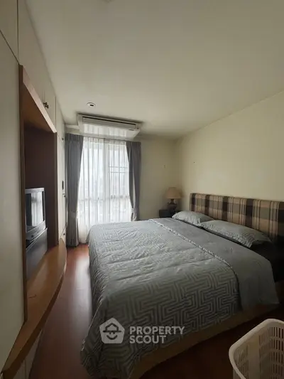 Cozy bedroom with natural light and modern decor