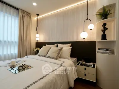 Elegant bedroom with modern lighting and stylish decor, perfect for a cozy and luxurious living experience.